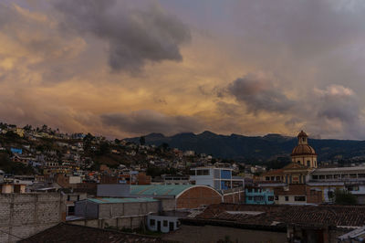 High angle shot of townscape against sky at sunset