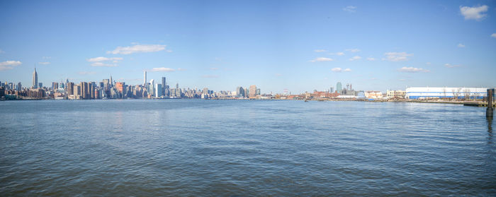 View of cityscape against blue sky