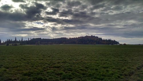 Scenic view of landscape against cloudy sky