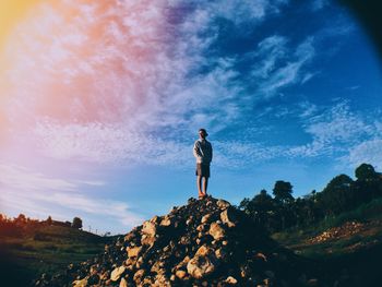 Full length of woman standing on rock