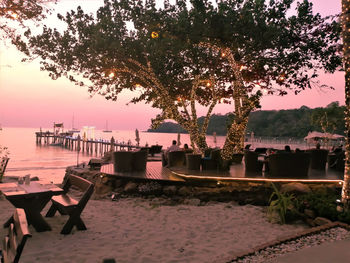 Scenic view of river against sky at sunset