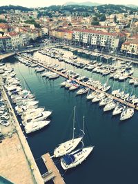 High angle view of harbor by buildings in city