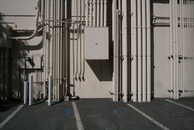 Metallic pipes on factory wall