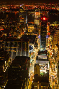 High angle view of illuminated buildings in city at night