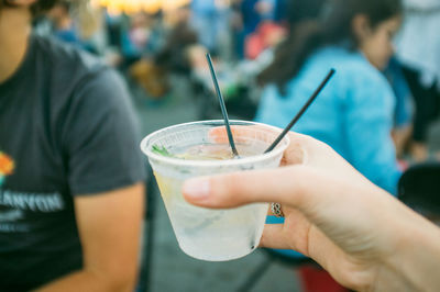 Close-up of hand holding drink