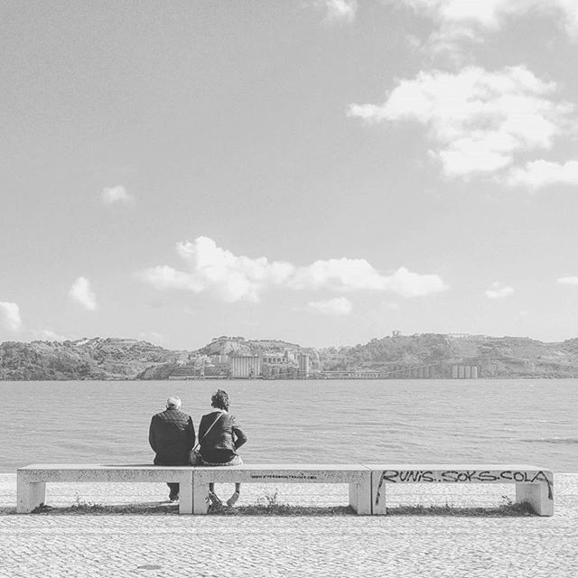 lifestyles, sitting, water, leisure activity, rear view, sky, relaxation, bench, men, lake, person, togetherness, cloud - sky, tranquility, river, nature, tranquil scene, scenics