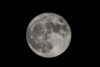 Close-up of moon against clear sky at night