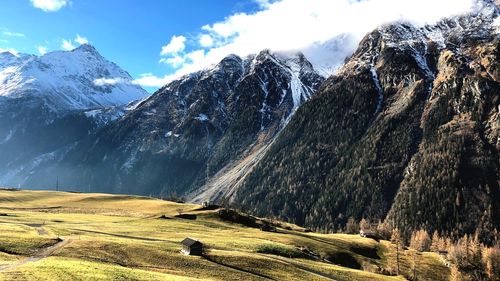 Scenic view of snowcapped mountains against sky