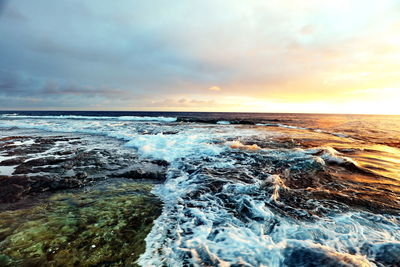 Scenic view of sea against sky during sunset