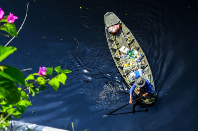 High angle view of man in floating boat