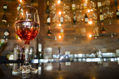 Close-up of wine in glass on table