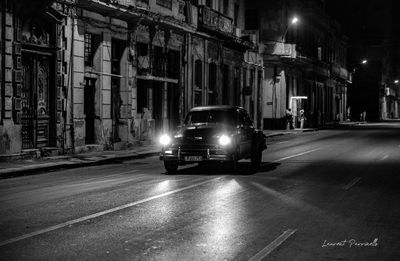 Cars on illuminated road at night