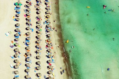 High angle view of people relaxing in row