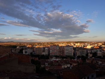 Cityscape against sky during sunset