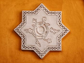 Directly above shot of ornate design on tiled floor