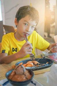 Portrait of boy holding ice cream