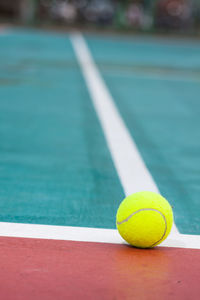 Close-up of tennis ball on court