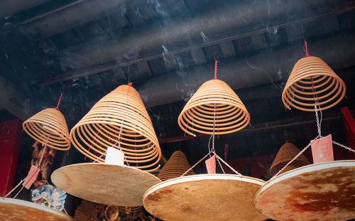 Clothes hanging on ceiling at market stall