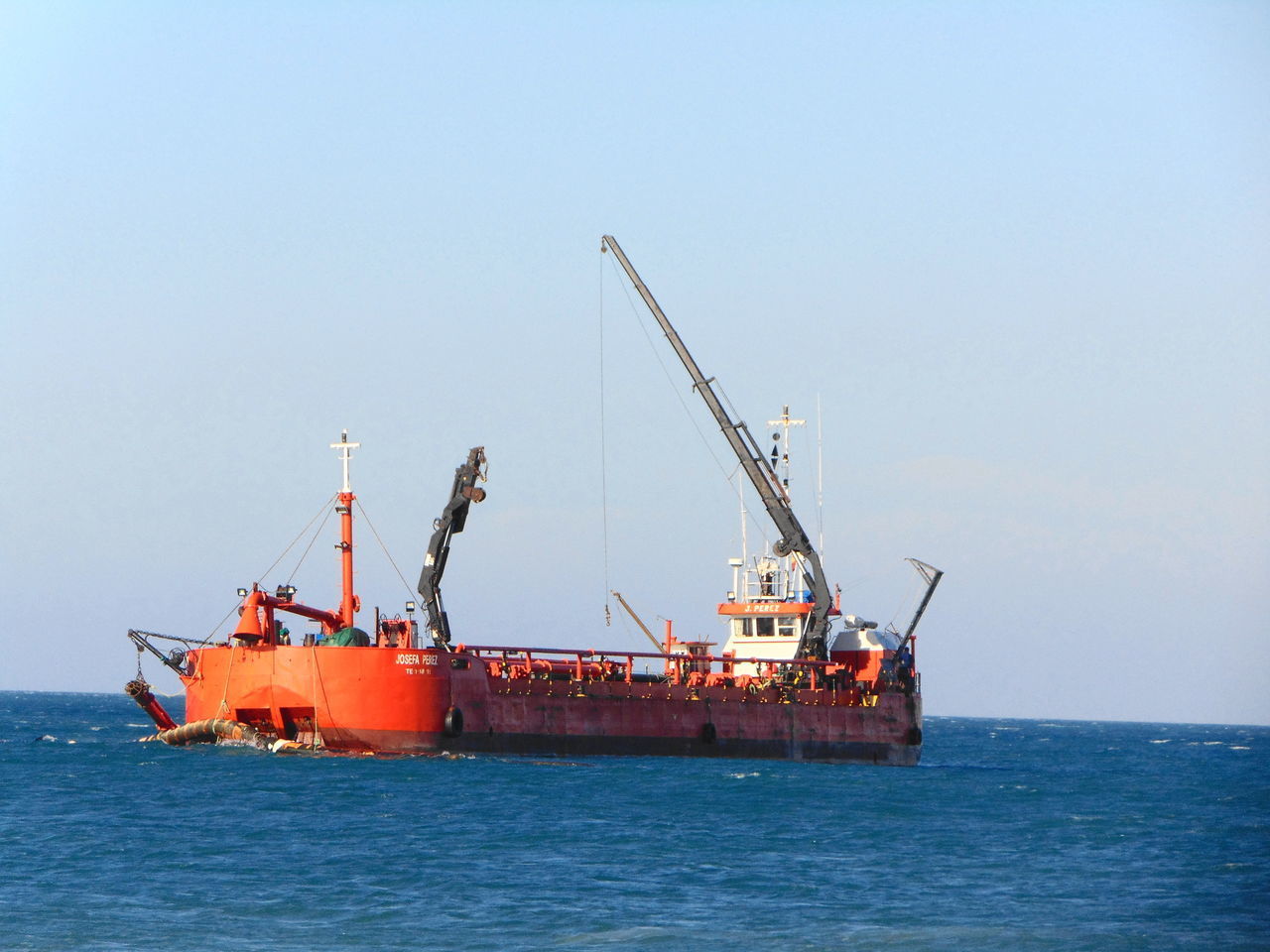 SHIP IN SEA AGAINST SKY