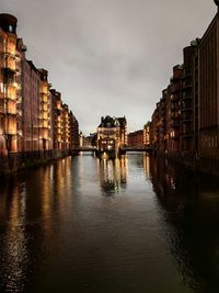 Canal amidst buildings in city