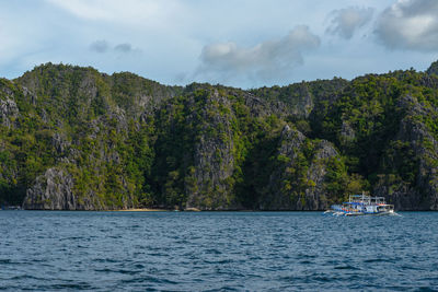 Photo showcases the stunningly rugged coastline of the philippines. a series of rocky outcroppings.