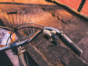 High angle view of bicycle parked by wall