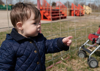 Little boy pointing at things at the county fair