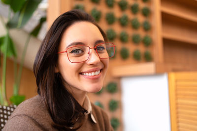 Portrait of young woman wearing sunglasses