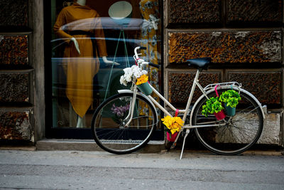 Bicycle on street against wall