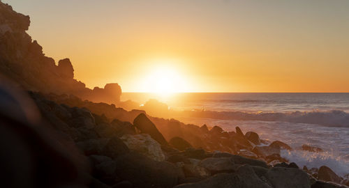 Scenic view of sea against sky during sunset