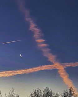 Low angle view of vapor trails in sky