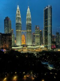 Illuminated buildings in city at night