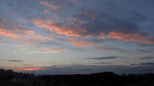 Scenic view of landscape against cloudy sky