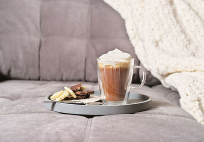 Close-up of coffee cup on table