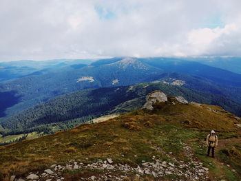 Rear view of mountain range against sky