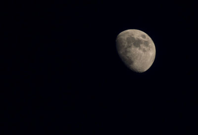 Low angle view of moon against clear sky at night