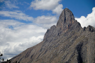 Low angle view of rock formations against sky