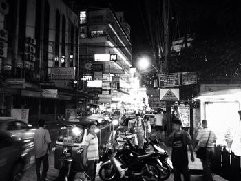 Illuminated city street at night