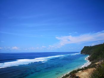 Scenic view of sea against blue sky