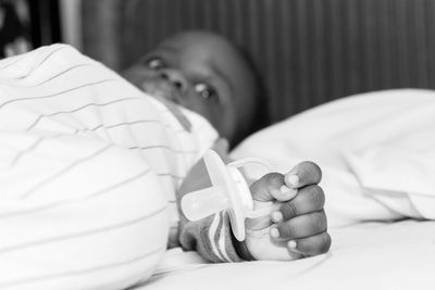 Portrait of boy relaxing on bed at home