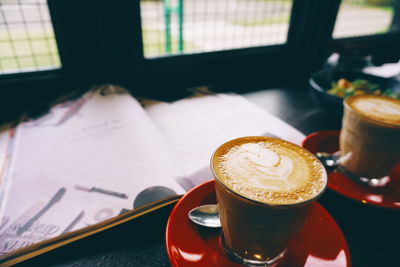 Close-up of coffee cup on table