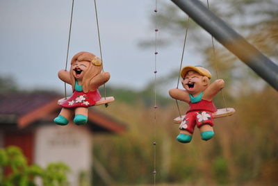 Close-up of toys hanging