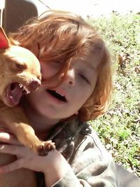 Close-up of young woman with horse