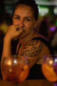 Side view portrait of woman sitting at restaurant