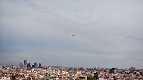 Aerial view of city against sky