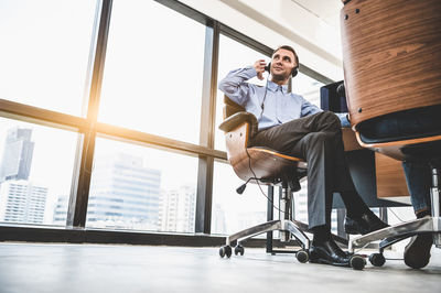 People sitting on chair in office