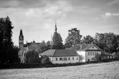 Houses and buildings against sky