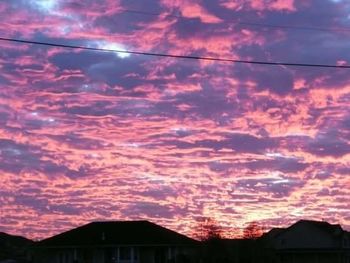 Low angle view of cloudy sky at sunset