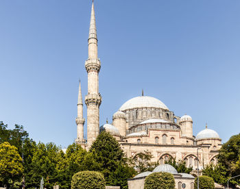 Low angle view of mosque against clear sky