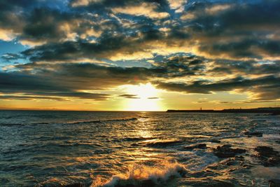 Scenic view of sea against dramatic sky